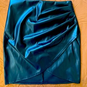 Cute leather black mini skirt. Never worn!